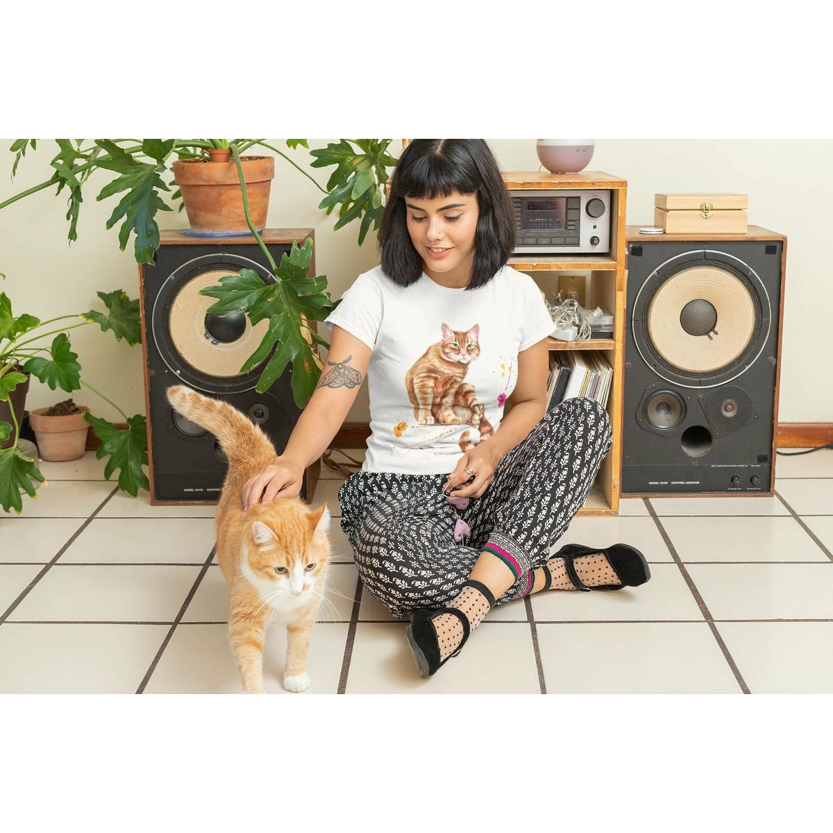 Woman wearing "Water Color," Gold Cat Tee Shirt.