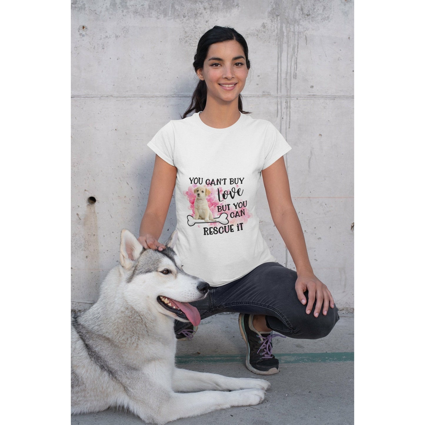 Woman wearing "You Can't Buy Love, But You Can Rescue it."  Tee Shirt with a puppy sitting on a bone. 